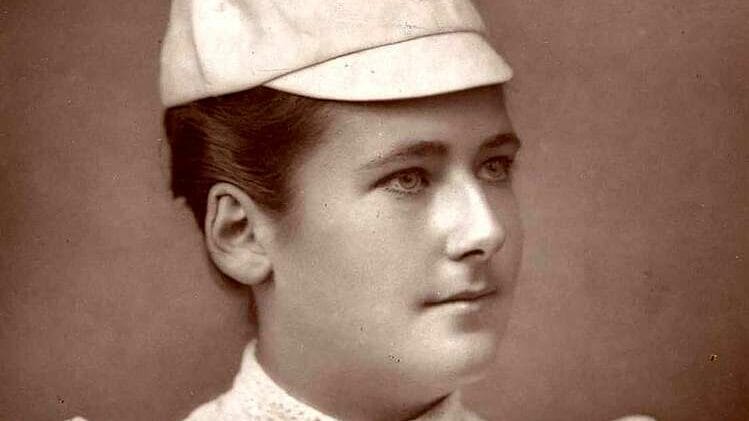 Lottie Dod, one of the greatest British sportswomen, holding her tennis racket as a Wimbledon champion