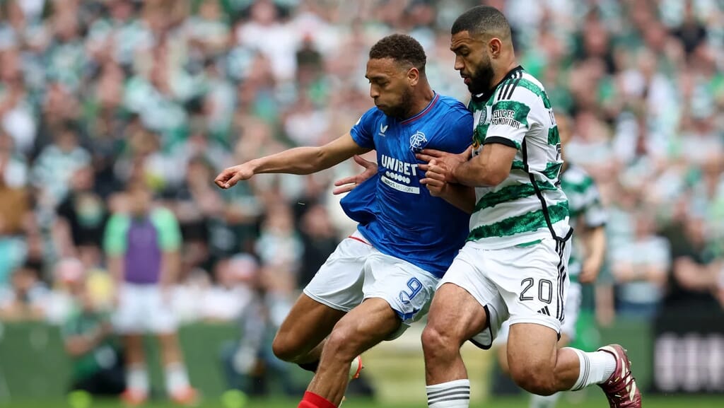 Celtic and Rangers fans at an Old Firm match, symbolising one of football’s greatest club rivalries.