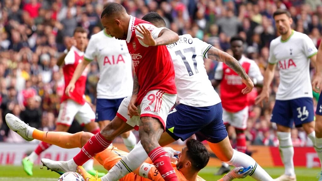 Arsenal and Tottenham fans at a North London Derby, a key fixture in the greatest club rivalries.