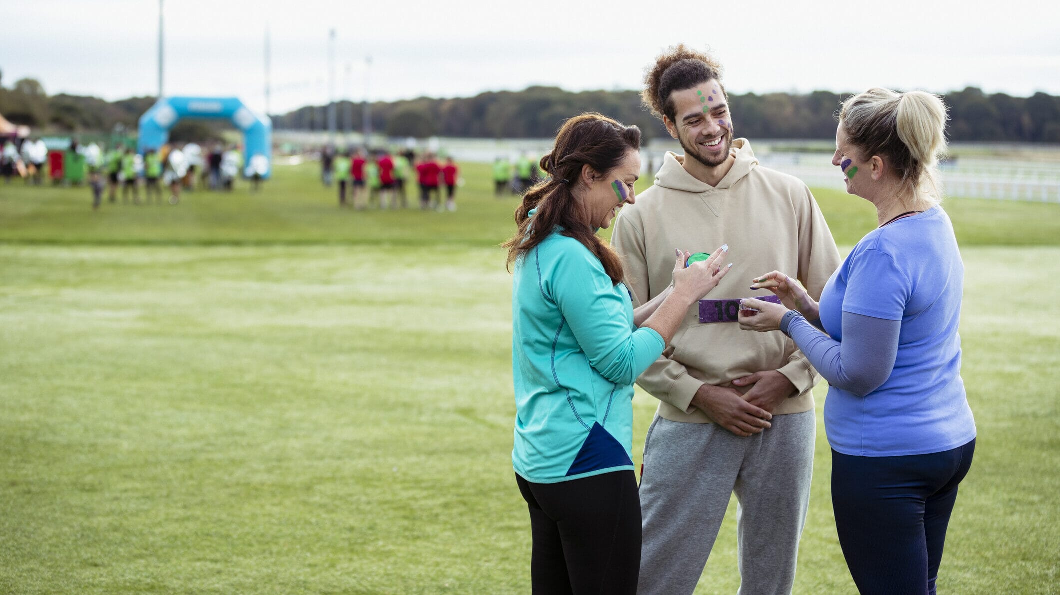Coach using a football team management app to organise schedules and communicate with the team.