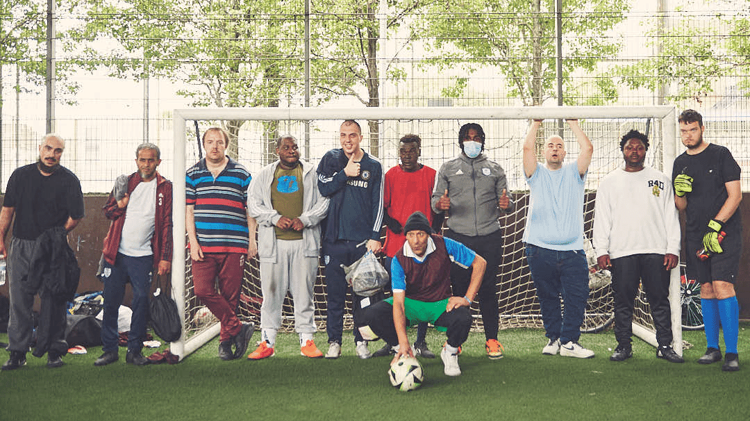 Minds United FC players posing for a team photo on the pitch.