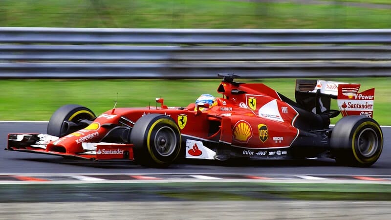Formula 1 race car speeding on a track during a Grand Prix, exemplifying one of the biggest sports in the world.