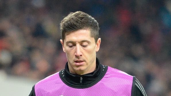 Image of Robert Lewandowski in a Barcelona jersey, one of the highest paid footballers, earning £800k per week.