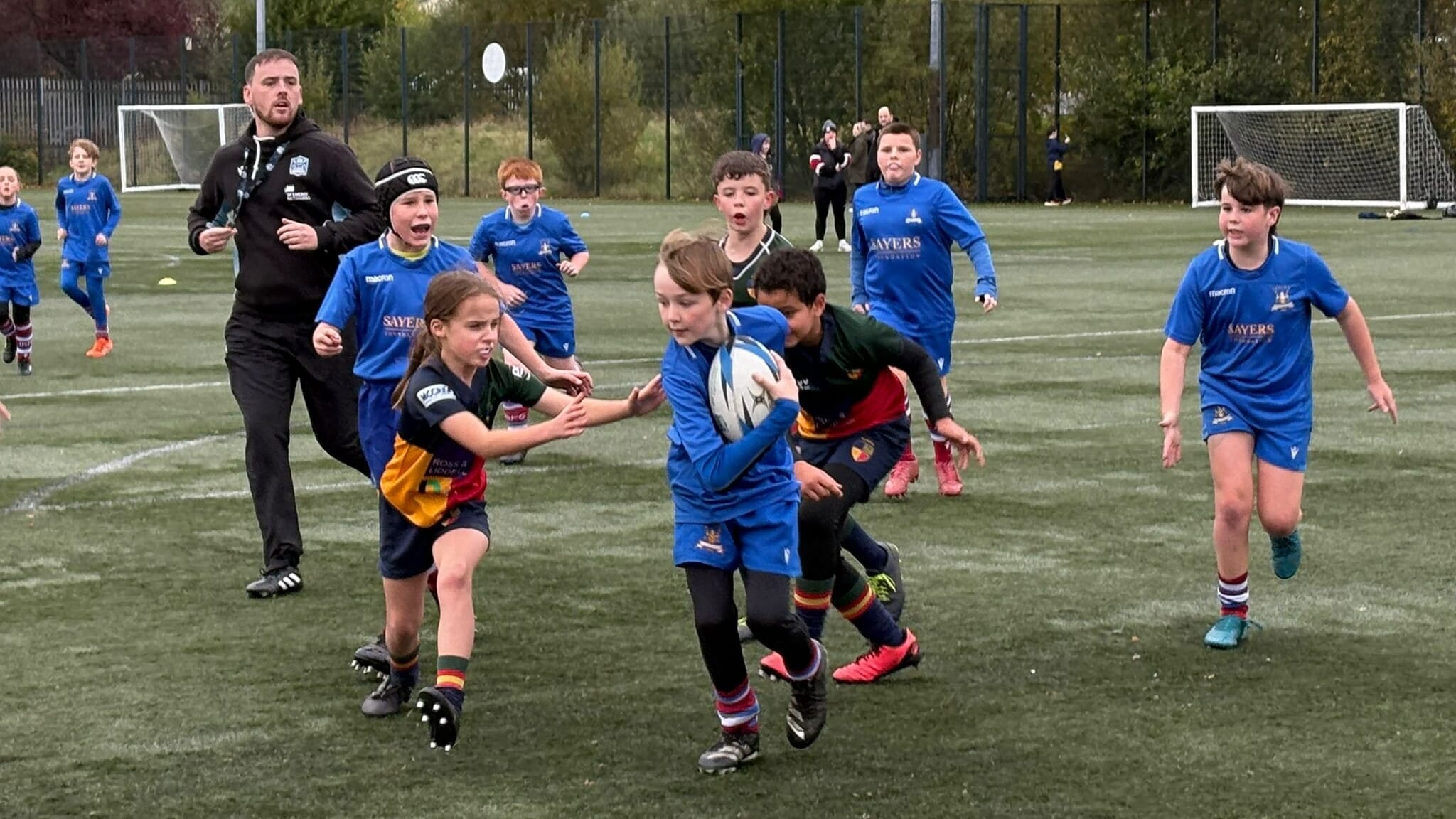 Coaches and youth players at Irvine RFC organising a training session through the rugby club app Spond