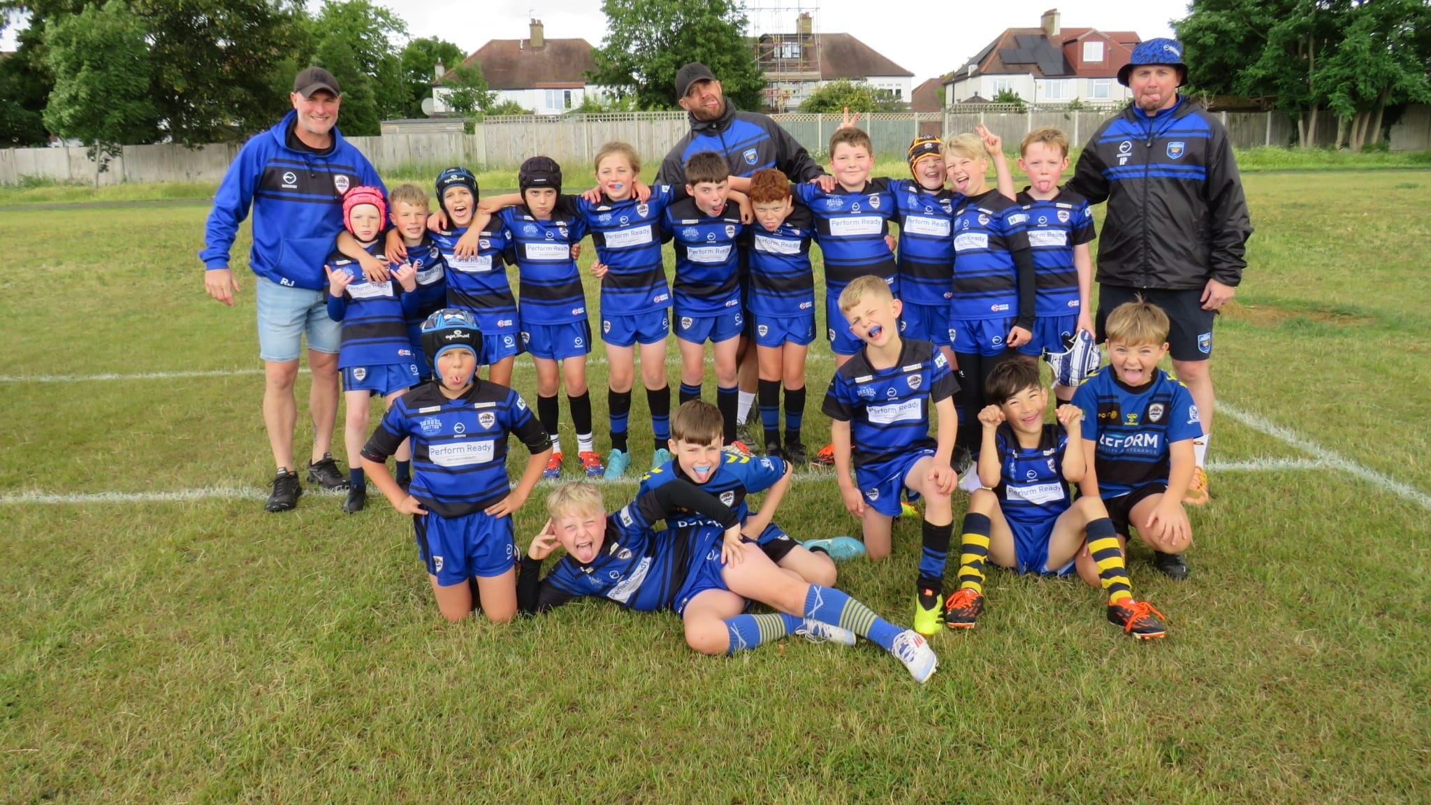 Junior rugby league team celebrating after a match in Ackworth, showing the community spirit supported by Spond