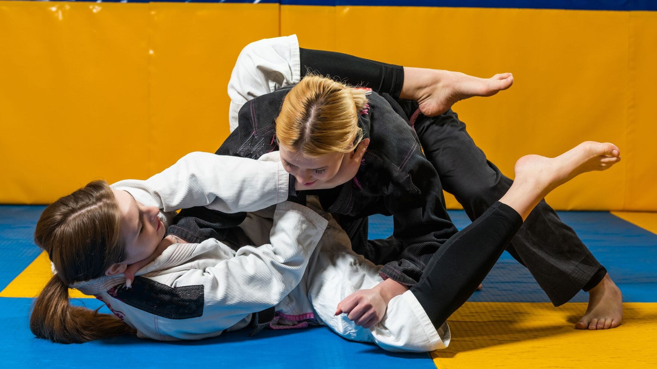 Fastest Growing Sports in the USA illustrated by a girls’ wrestling match at a school competition